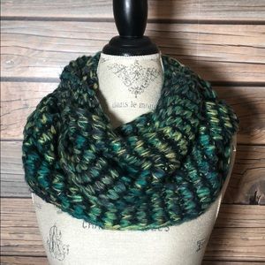 Knit scarf in blues, green, yellow.